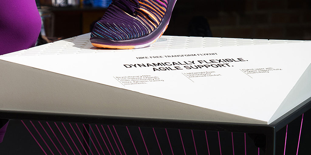 Image of shoe display with triangular printed graphic
