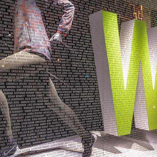 Image of a window display with thousands of names applied to the window in cut vinyl