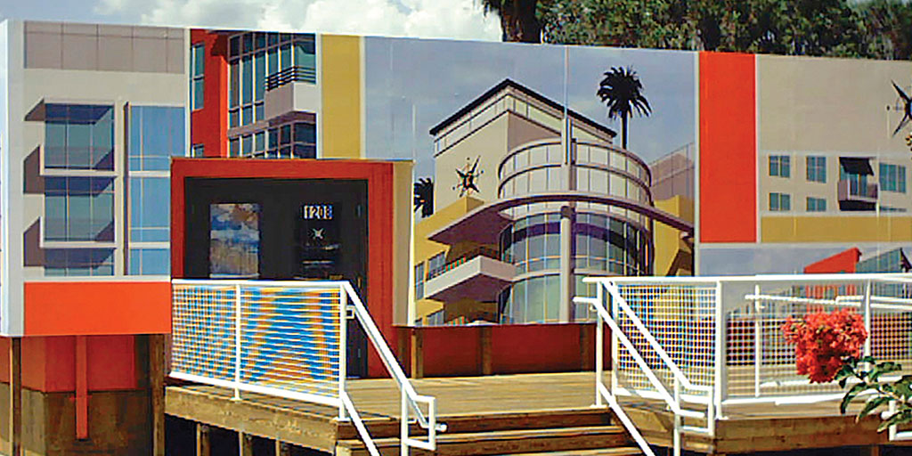 Image of the exterior of a building wrapped with a complex graphic