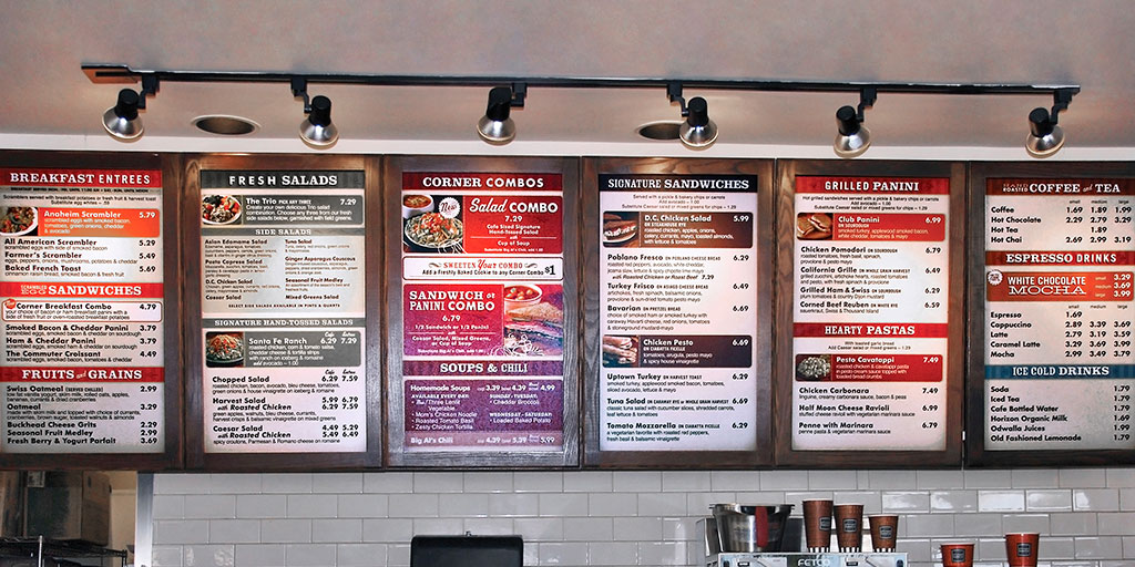 Image of several menu boards on display in a cafe