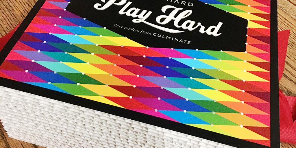 Image of a colorful graphic on top of a box made of corrugated cardboard