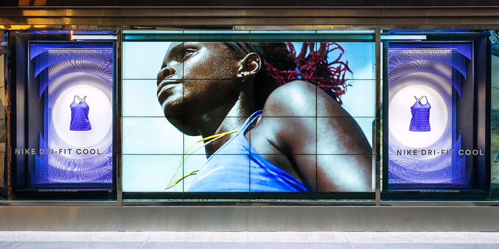 Image of a window display with cut-out fabric display