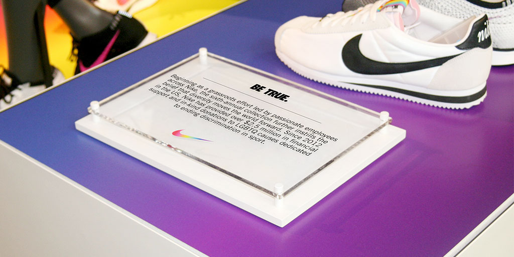 Image of shoe display with printed clear acrylic sign